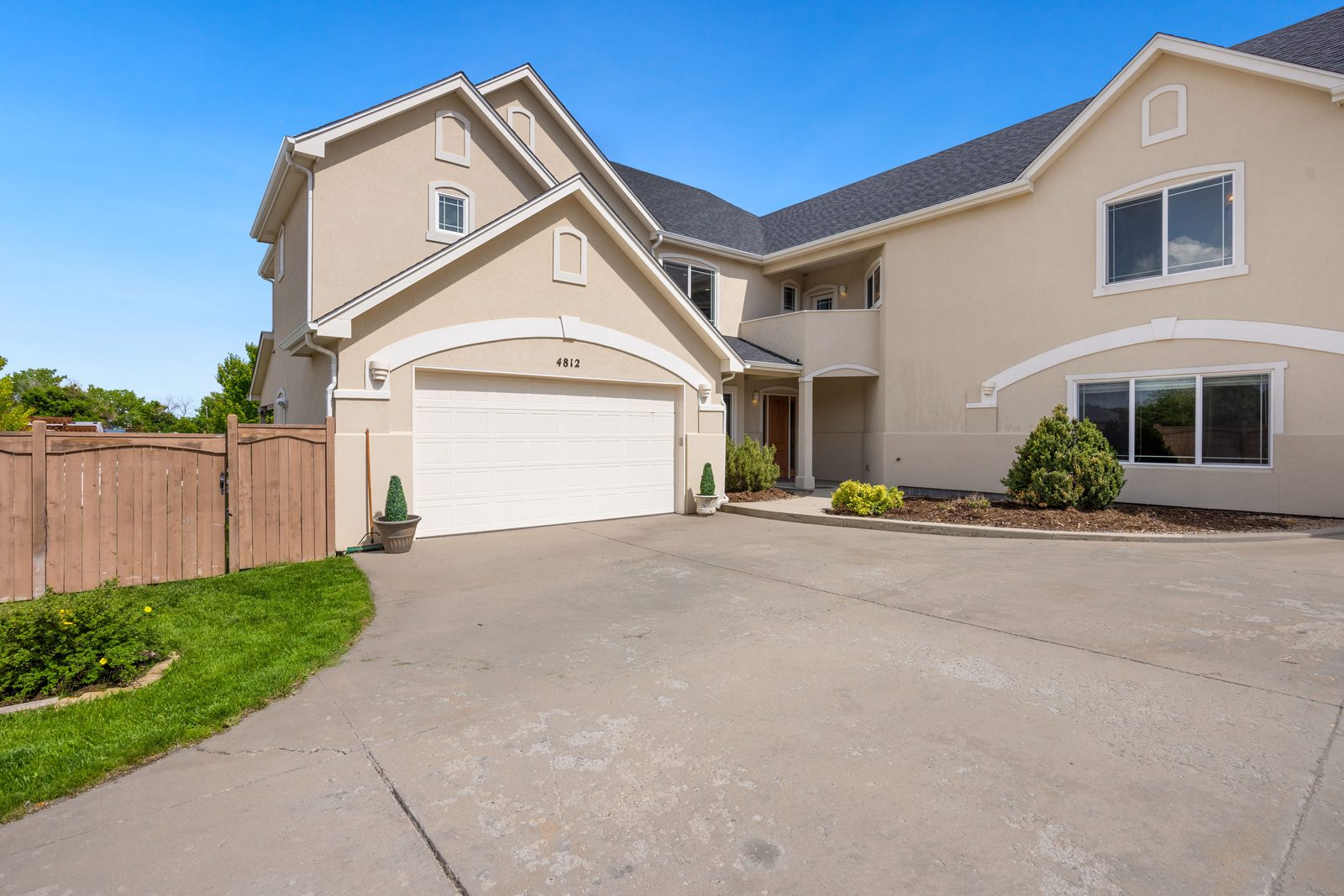 Two-story Hampton Roads home with a clean, well-maintained shingle roof
