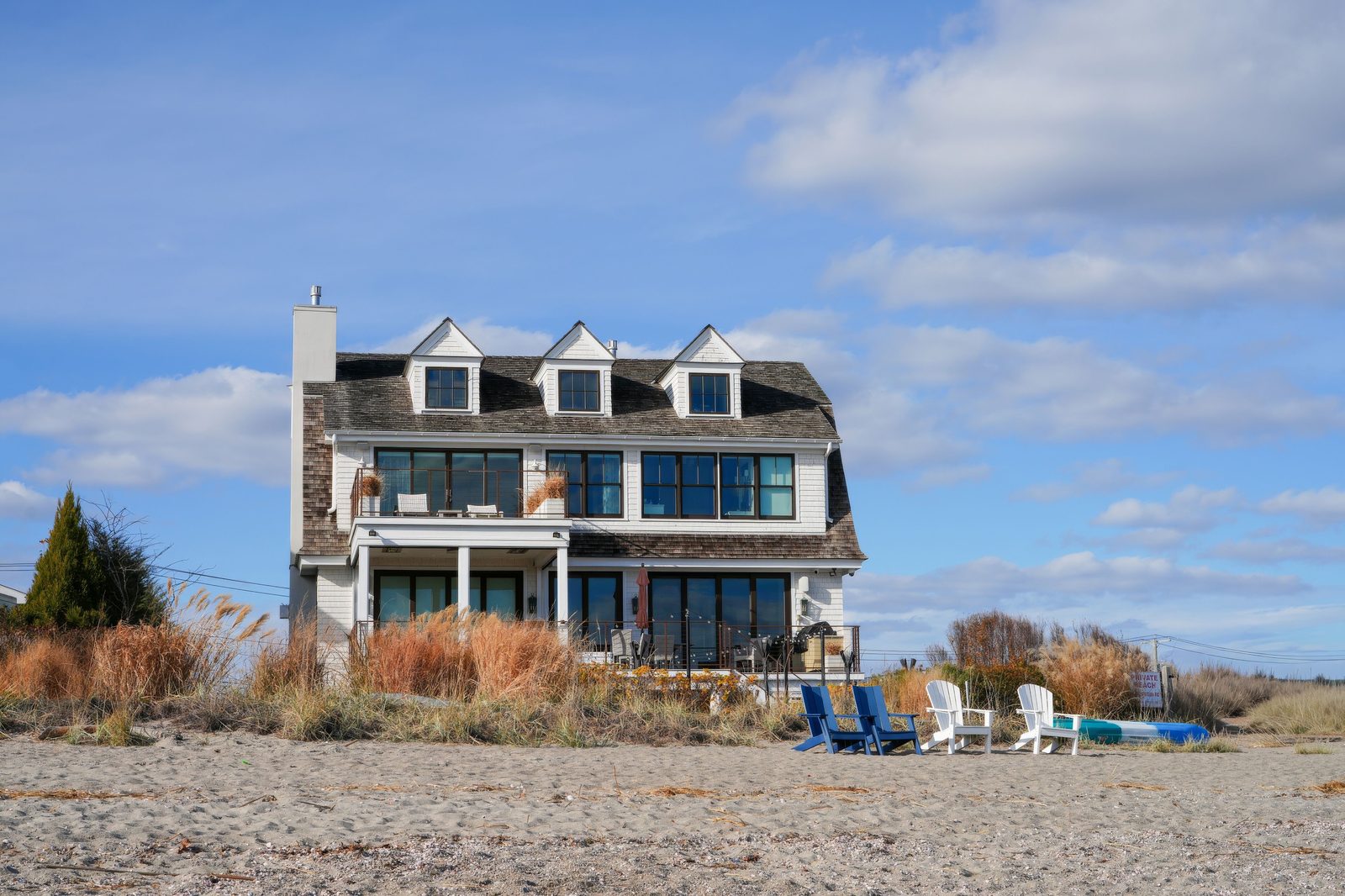 Classic gray-shingle coastal Virginia home with dormer roofs in the Hampton Roads area